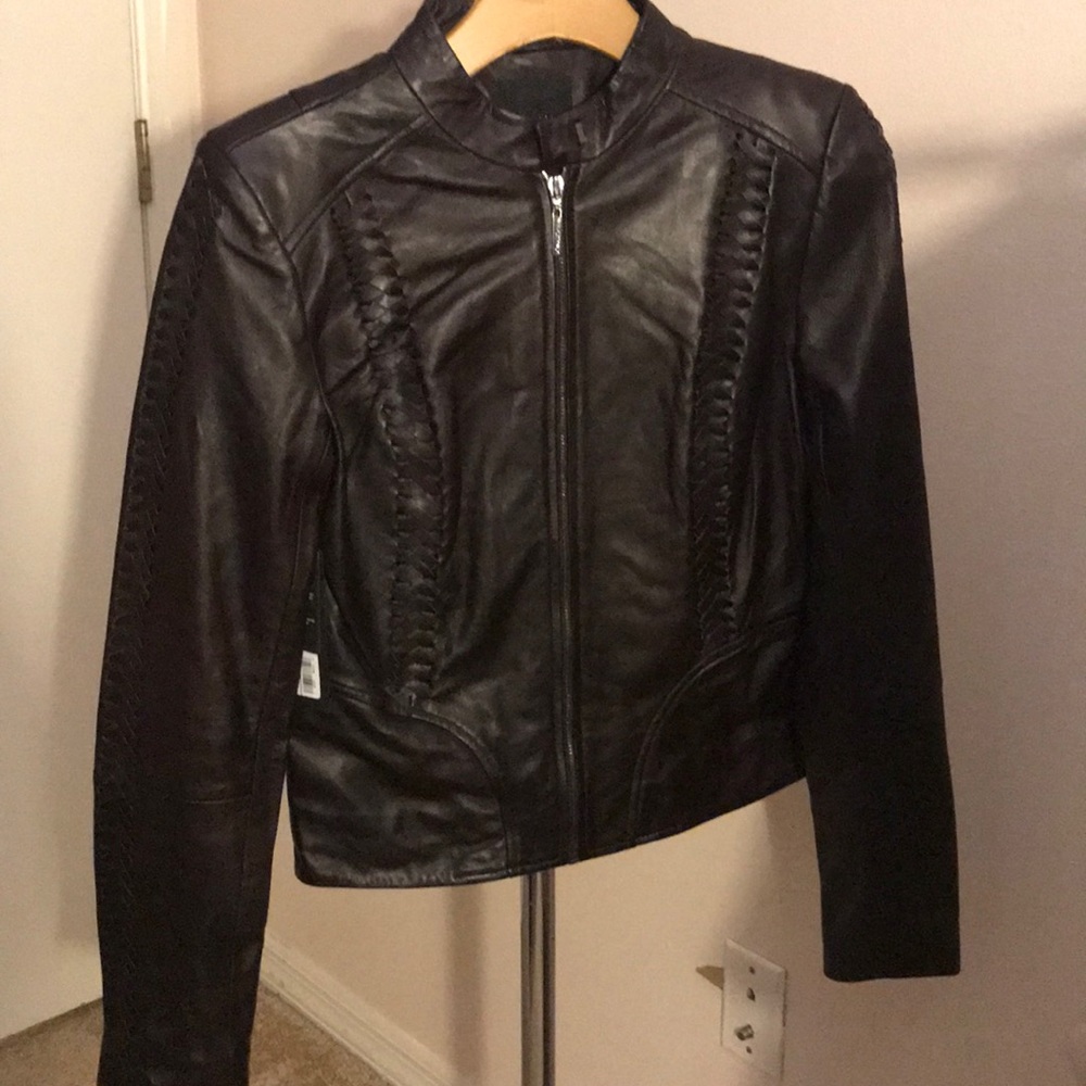 Brown 100% leather jacket.